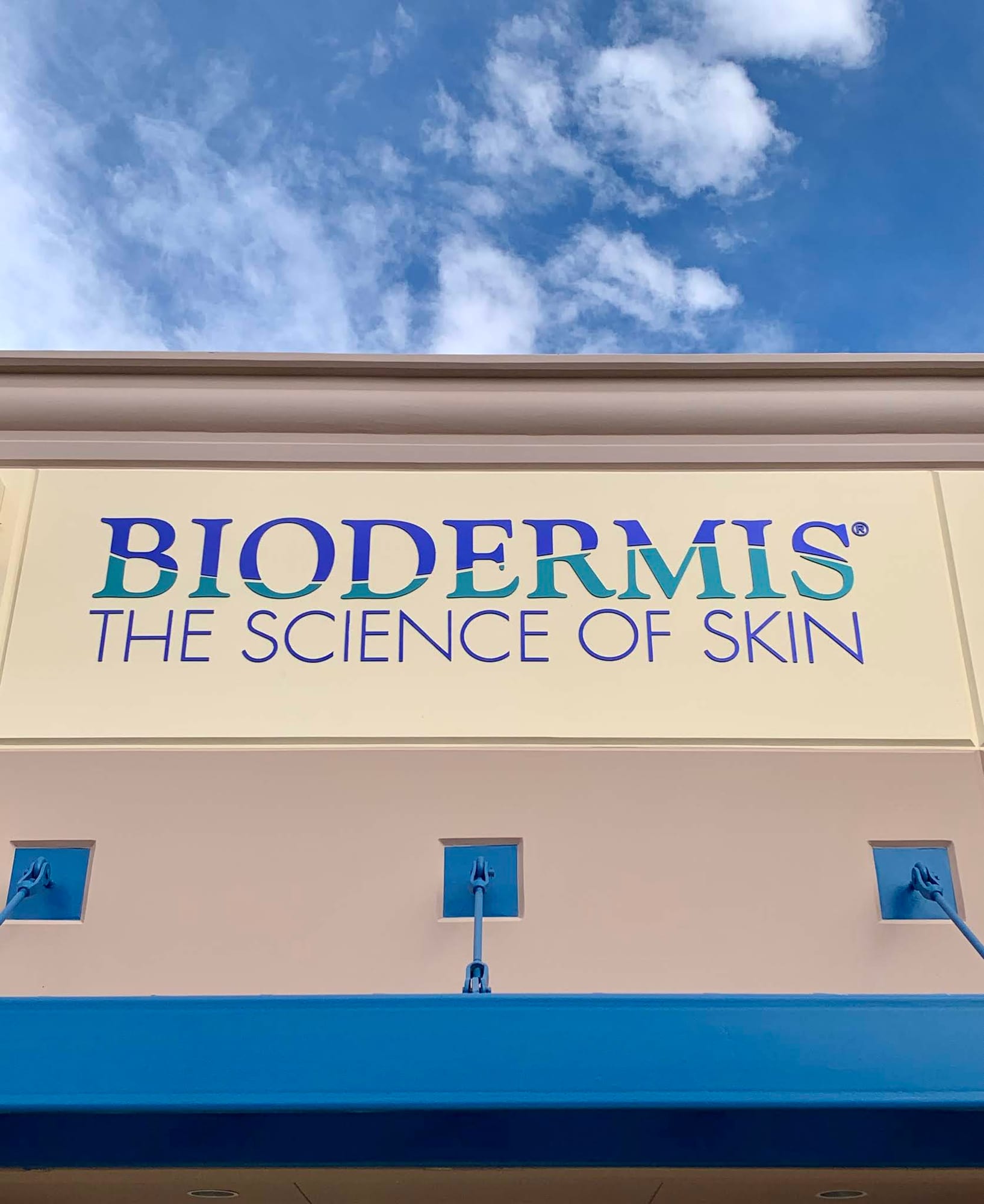 storefront wall sign las vegas Biodermis storefront sign: “The Science of Skin” in blue and teal letters on the building front