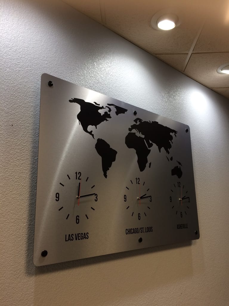custom office wall graphics las vegas Brushed aluminum world map wall panel with time zone clocks for Las Vegas, Chicago/St. Louis and Asheville