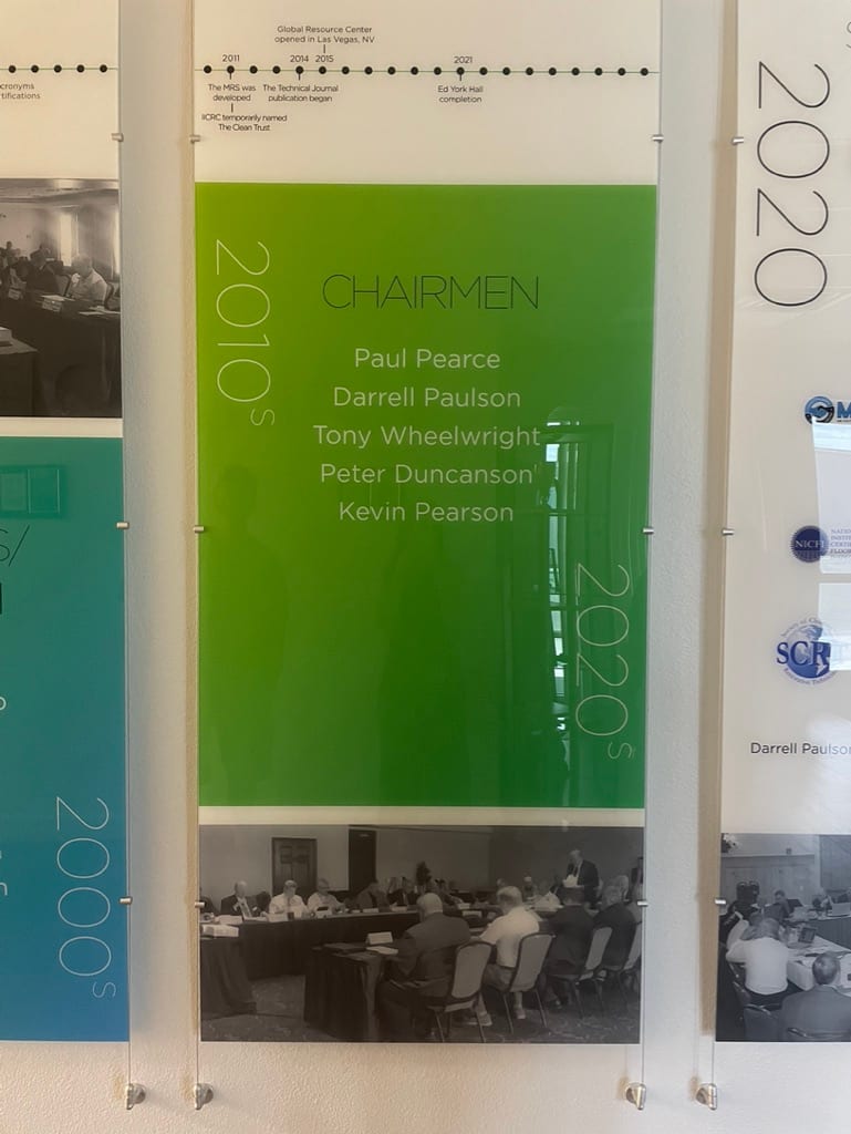 office history wall graphics las vegas Company history wall: printed timeline panels with photos, mounted on standoffs