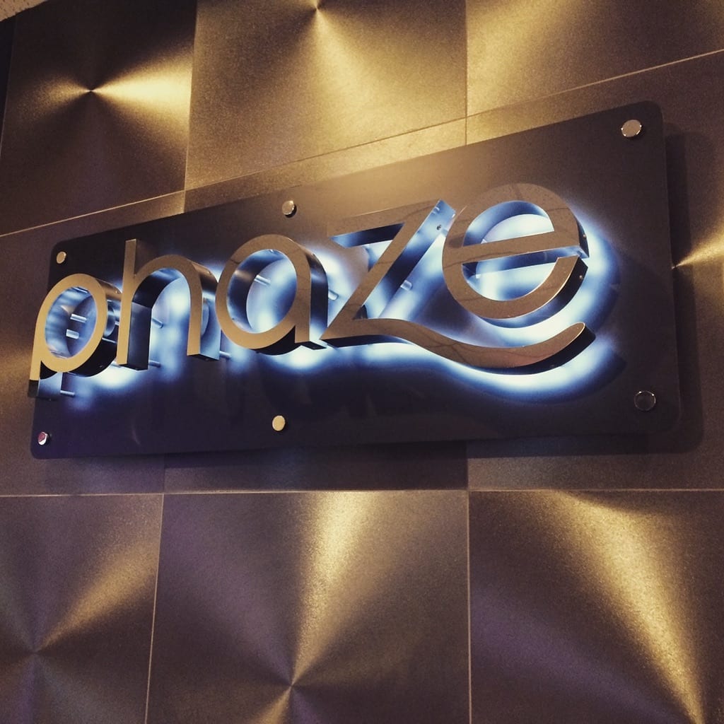 backlit brushed metal lobby sign Phaze backlit lobby sign: halo-lit letters on a brushed metal panel