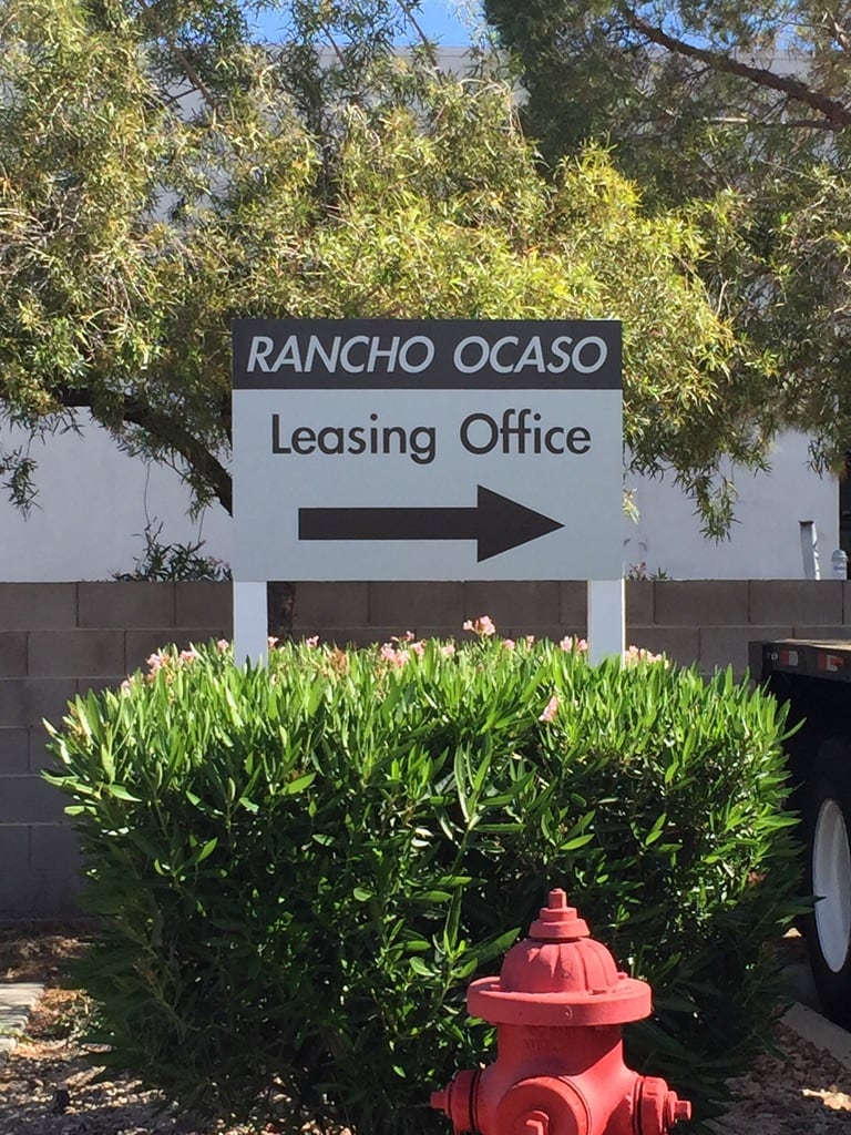 apartment directional sign Rancho Ocaso leasing office directional sign with an arrow
